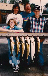 family of four with fish